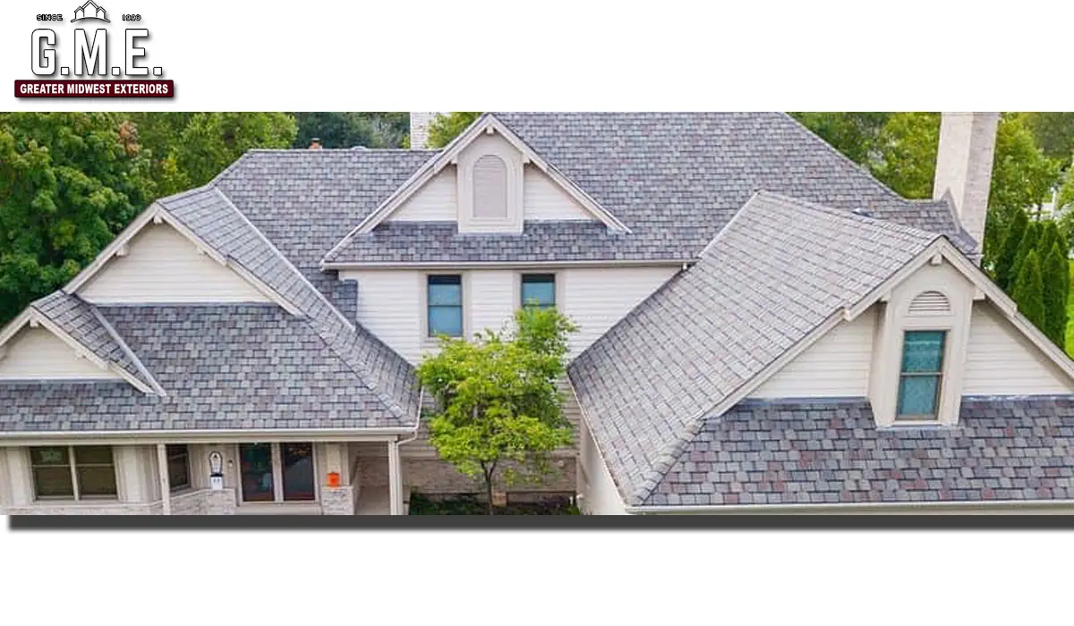 A large home with asphalt roofing shingles. A home with excellent roof condition.