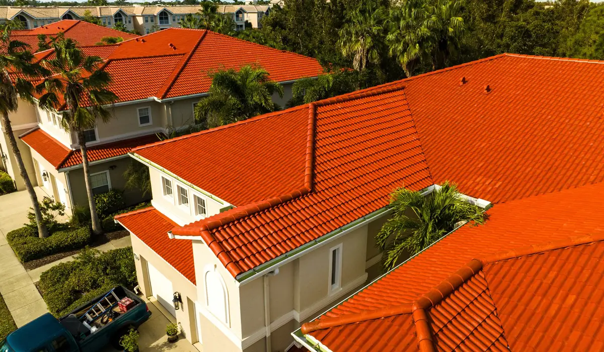 Spanish tile roofs are installed on two-story houses in a subdivision.